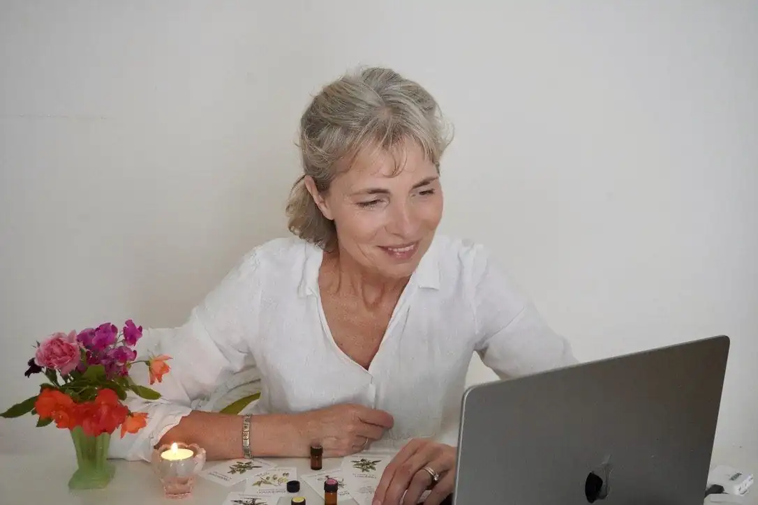 Corinna applying oil to a point on her wrist