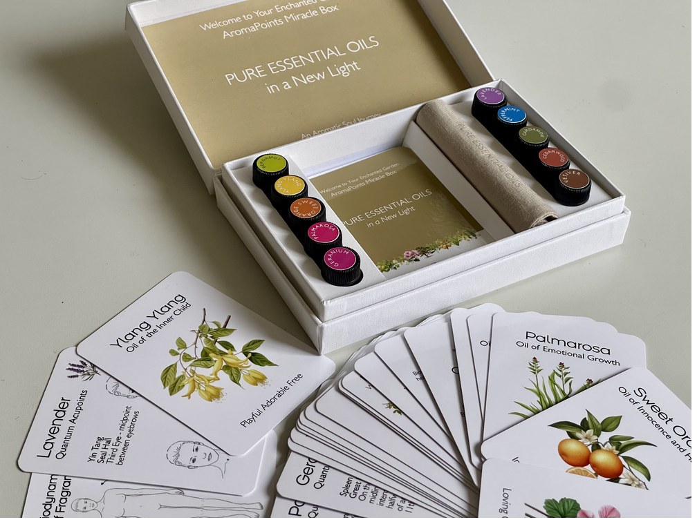 The AromaPoints Miracle Box — ten pure essential oils and illustrated cards