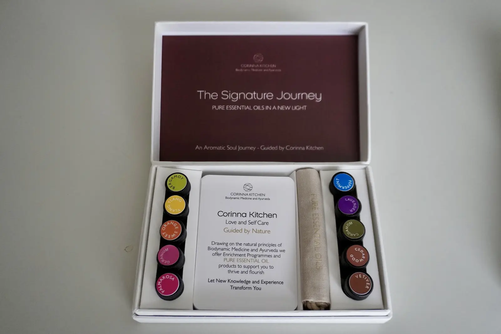 The Signature Journey box, open, with its ten pure essential oils